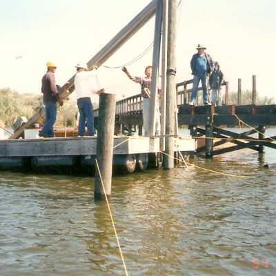 Bridge construction 1994. Roger Hamm, Milt Webb, Joe Manion, Ray Folch, and Nancy Warren.