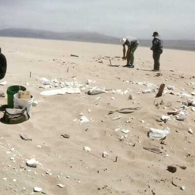 1997 Ten Commandments excavation. Broken wood and plaster pieces lie on the surface.