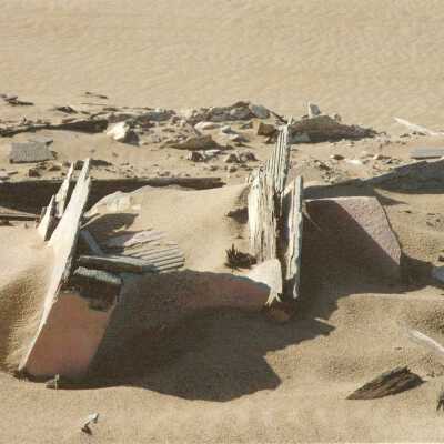 1997 Ten Commandments excavation.Broken plaster and wood pieces buried on the surface level.