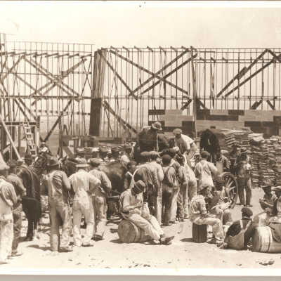 1923 workers breaking for lunch on set.