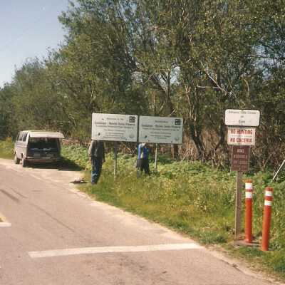Installation of signs on beaches 3/1996. Don Wood and Frank Perez at Guadalupe Beach entrance.