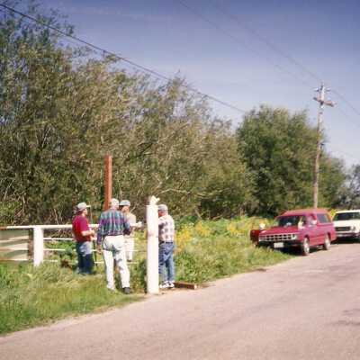 Installation of signs on beaches 3/1996. Chuck Warner, Dick Williams, Pete St. John, Jim Neuschwander at Main St entrance gate.