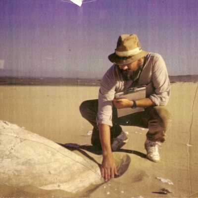 1997 Ten Commandments excavation. Man overlooking excavation of large plaster piece.