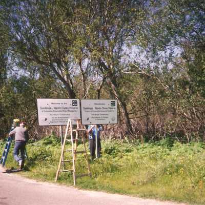 Installation of signs on beaches 3/1996.Don Wood and Frank Perez at Main St entrance.