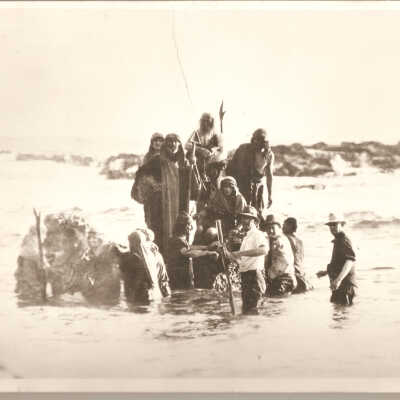 Cast and crew filming water scene.
