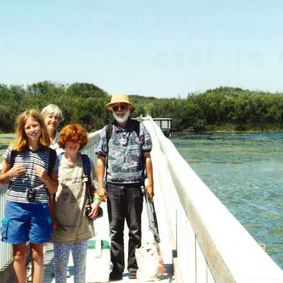 Undated color photograph of Tom Neuman, Theresa Hoffman, and two children on Oso Flaco Lake Bridge; 4" x 6" color photograph