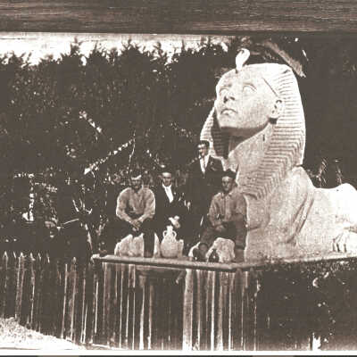 4 men pose in front of sphinx taken from set of The Ten Commandments.