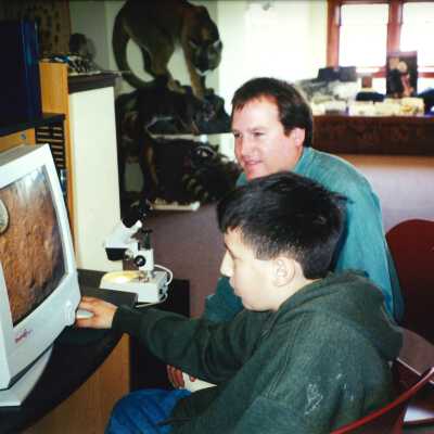 Jon True with Student; Unspecified Elementary School Field Trip 2001; 4" x 6" color photograph