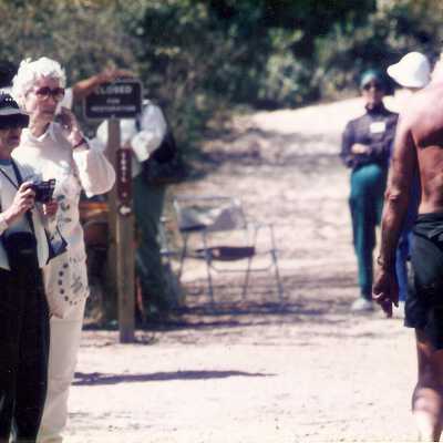 Shirley Boydston (rear) mans Station #3 Chumash and Pioneers - Family Day 9/95