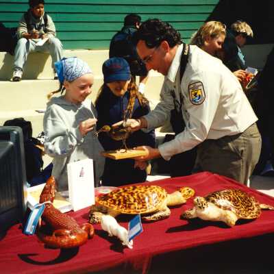 Chris Barr, US Fish and Wildlife Service with an unspecified Elementary School Field Trip 2001; 4" x 6" color photograph