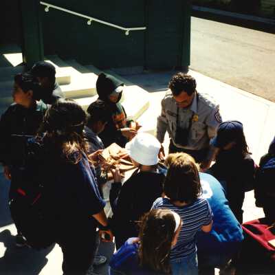 Chris Barr, US Fish and Wildlife Service with an unspecified Elementary School Field Trip 2001; 4" x 6" color photograph