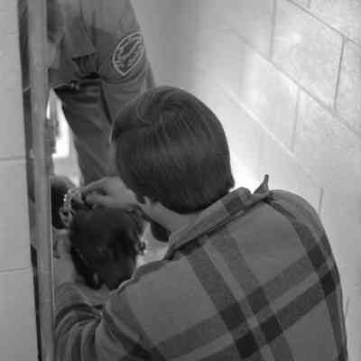 Unidentified men and dog, Humane Society, Date unknown: Frame 11