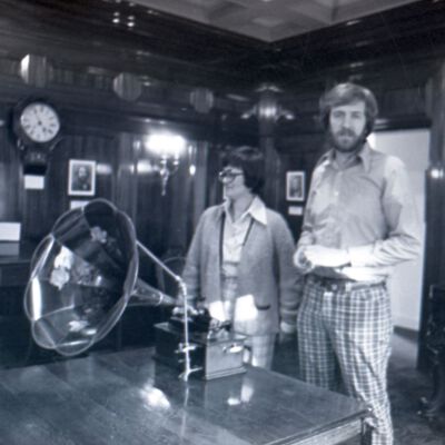 Unidentified man and woman with phonograph, 1976: Frame 38c