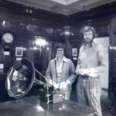 Unidentified man and woman with phonograph, 1976: Frame 39c
