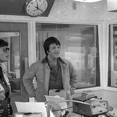 Unidentified people and P. J. Kirkland, Radio Studio, Date unknown: Frame 7b