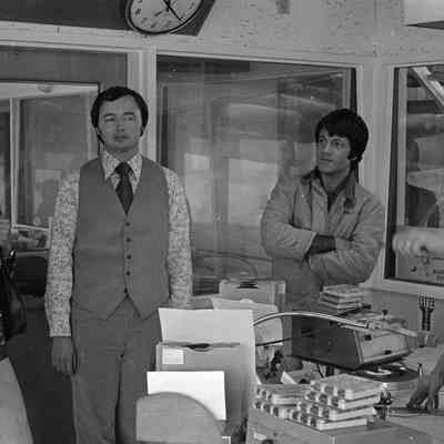Unidentified people, Dick Pust, and P. J. Kirkland, Radio Studio, Date unknown: Frame 15b