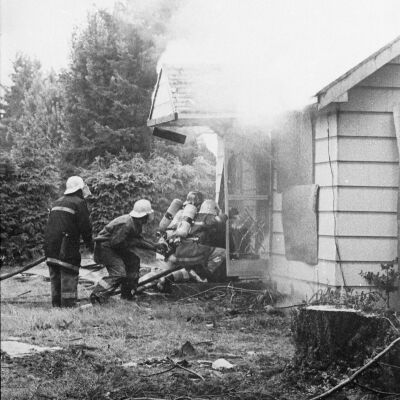 Firefighters putting out fire, Date unknown: Frame 9