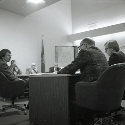 Ken Ahlf, Vernon Stoner, and Unidentified poeple, Lacey City Hall Hearing, 1980: Frame 44a