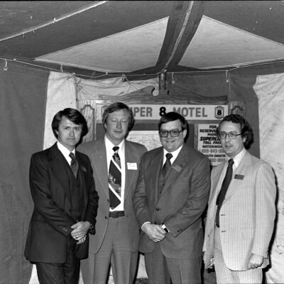 Unidentified men and Larry Knudsen, Super 8 Motel, January 17, 1980: Frame 3