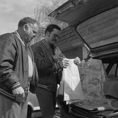 Unidentified men, Lacey Leader Office parking lot, Date unknown: Frame 1