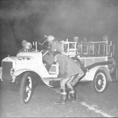 Firefighters in firetruck, Timberline High School, October 17, 1972: Frame 19