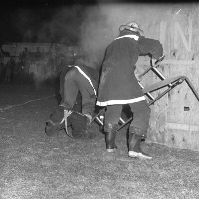 Firefighters putting out a fire, Timberline High School, October 17, 1972: Frame 6