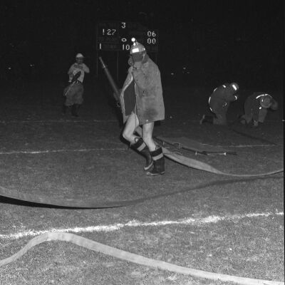 Firefighters putting out a fire, Timberline High School, October 17, 1972: Frame 7