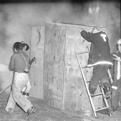 Firefighters putting out a fire, Timberline High School, October 17, 1972: Frame 9