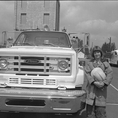 Unidentified firefighter and firetruck, Date unknown: Frame 3