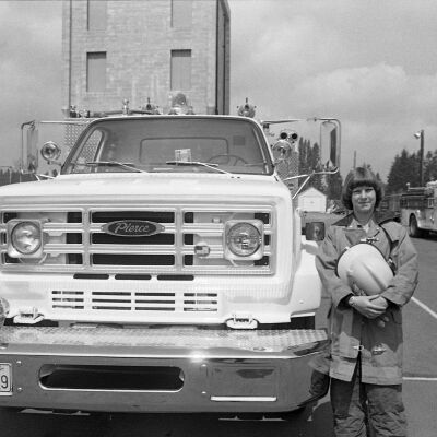 Unidentified firefighter and firetruck, Date unknown: Frame 4