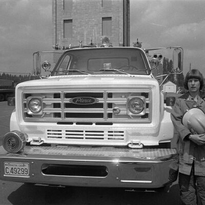 Unidentified firefighter and firetruck, Date unknown: Frame 5