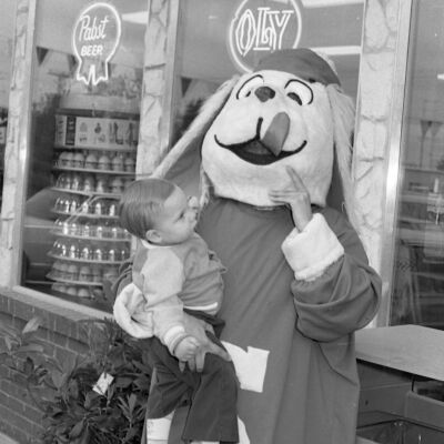 Unidentified child and mascot: Frame 42