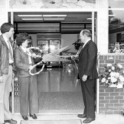 Unidentified men and Karen Fraser, Date unknown: Frame 8a