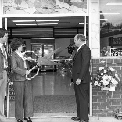 Unidentified men and Karen Fraser, Date unknown: Frame 9a
