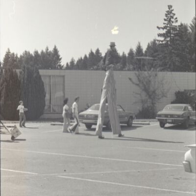 Unidentified man on stilts, St. Martin's campus, 1976: Frame 25d