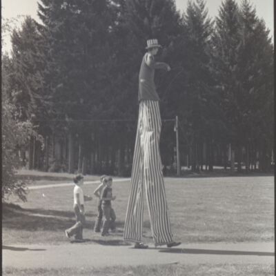 Unidentified man on stilts, St. Martin's campus, 1976: Frame 26d