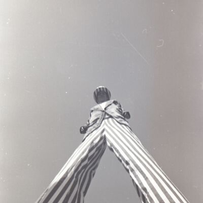 Unidentified man on stilts, 1976: Frame 22c