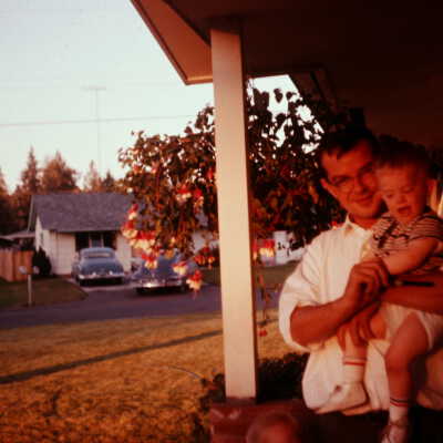 Bob Chamberlain holding his son, Richard Chamberlain, 1961