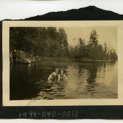 Ruth Hamilton, Phoebe Greenman, and Others Standing in Long Lake; Unknown Date
