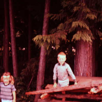 Becky and David Chamberlain behind their house, c. 1960