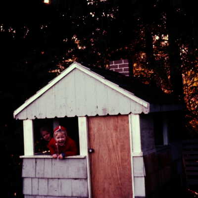 Becky and David Chamberlain in their playhouse, c. 1961