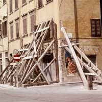 Scanned photo of a building being braced