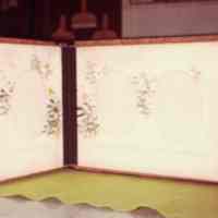 Photo of the inside of an album with a floral design