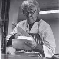 Photo of Patri working on a limp vellum cover