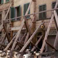 Scanned photo of building being braced