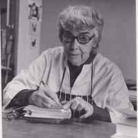 Photo of Patri making marks on a cover