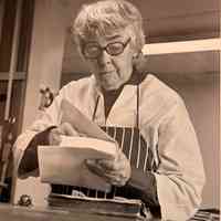 Black and White Photograph of Patri Working on a Limp Vellum Cover