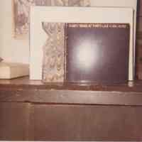 Photo showing papers from books on a workbench