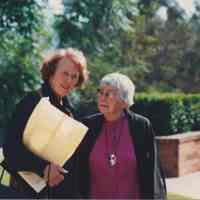 Photo of Stella Patri standing next to another