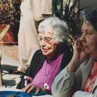 Photo of Stella Patri sitting with another woman